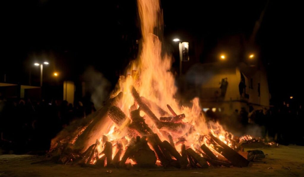 Holika Dahan bonfire at night during Holi festival celebration in India