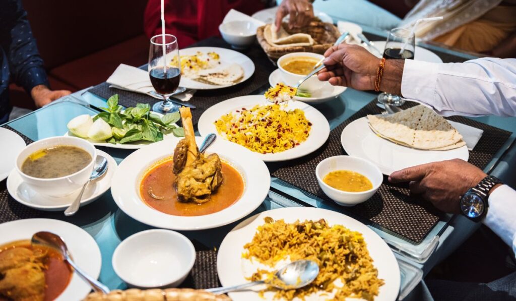 fine dining experience near Taj Mahal with Indian food dishes served on table