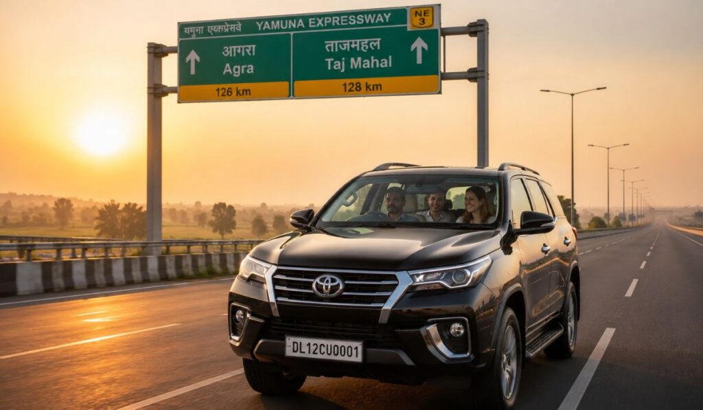 Luxury SUV driving on Yamuna Expressway toward Agra and the Taj Mahal during sunrise