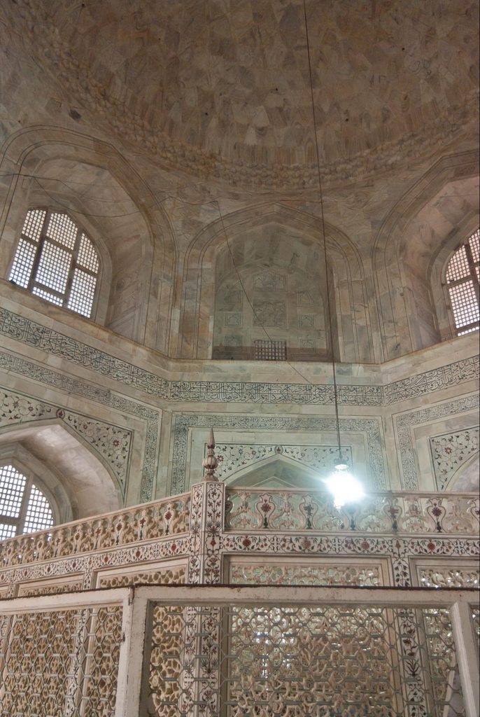 Interior vaulted chamber of the Taj Mahal showing arched marble walls and high ceiling
